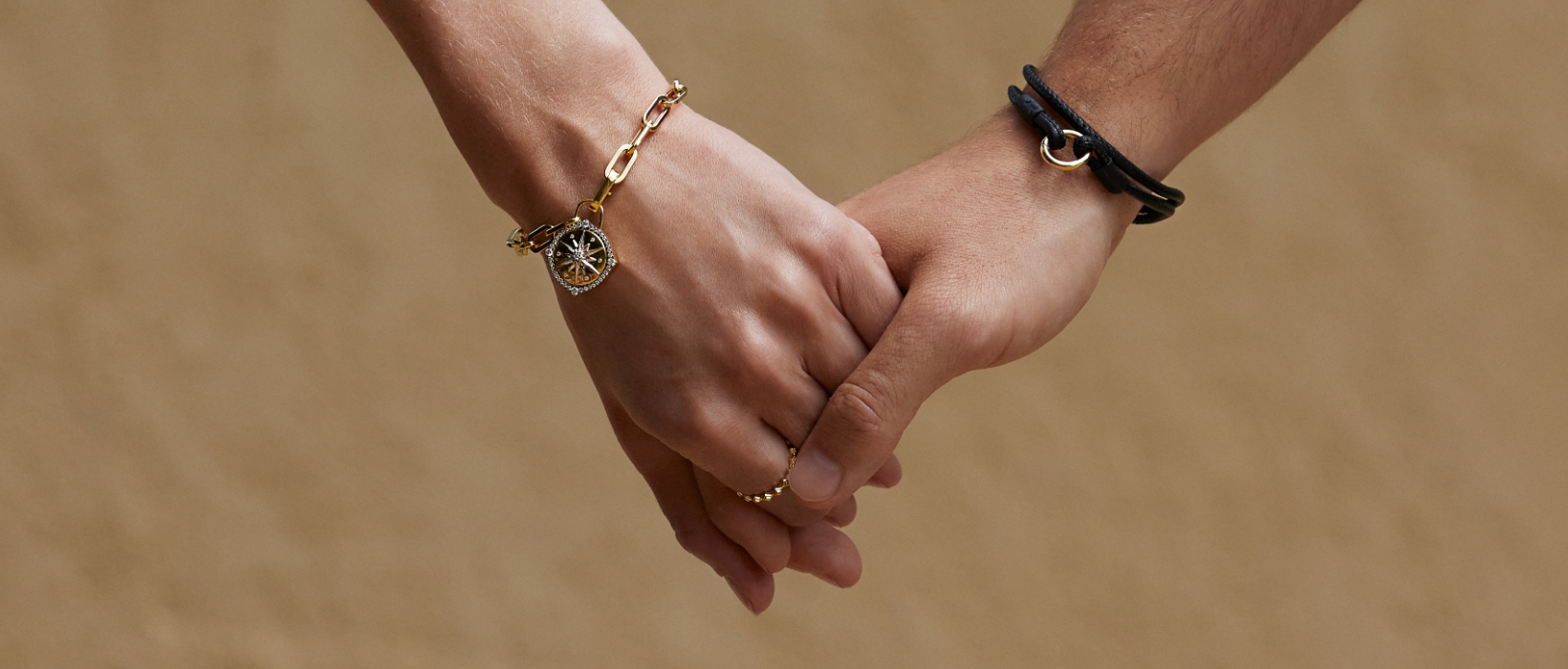 holding hands wearing bracelets