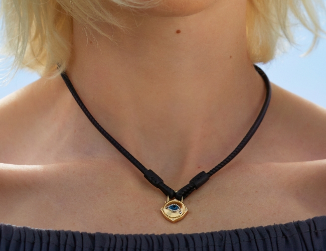 leather necklace with lock charm worn by model
