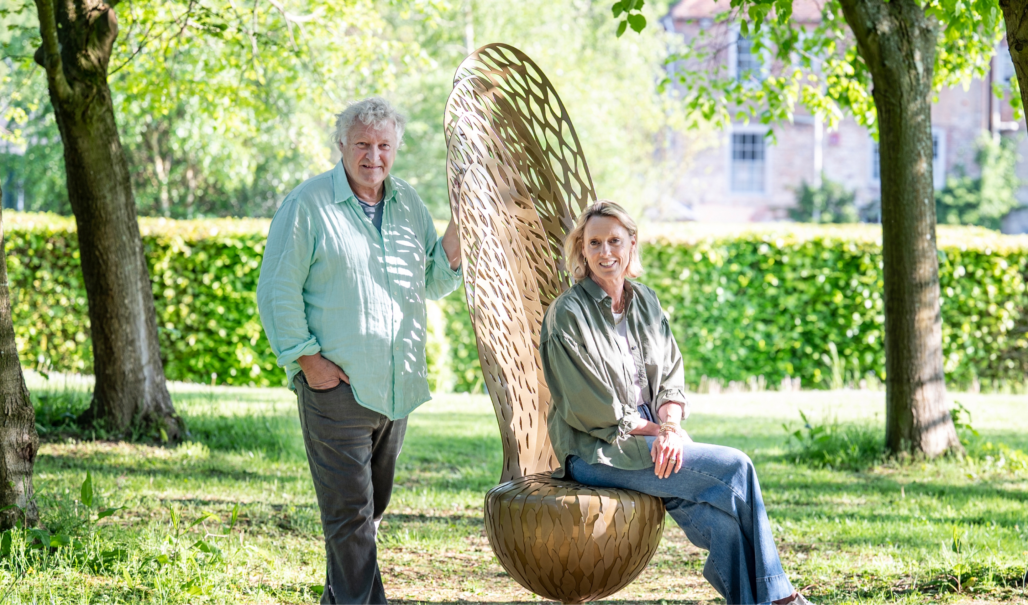 David Harber and Annoushka Ducas posing in garden