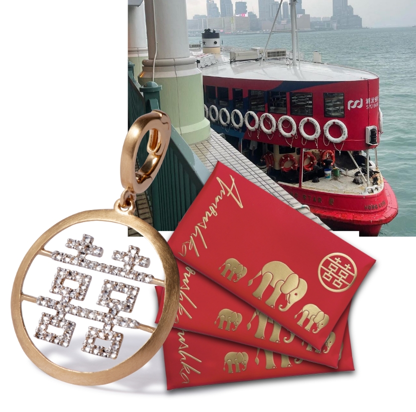 diamond and gold charm with envelope and boat