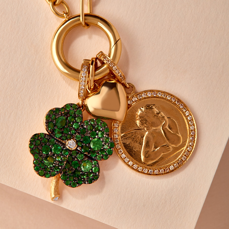 18ct gold clover and cherub charms on chain