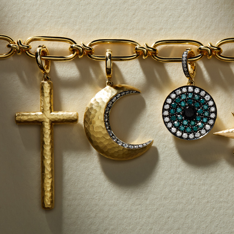 18ct gold cross, evil eye and moon charm on chain